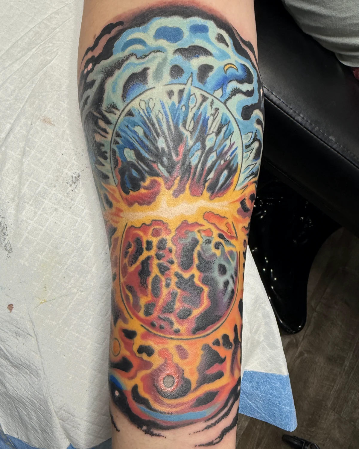 Blue and orange cosmic tattoo with celestial imagery by Nicole Miller in Missoula Montana