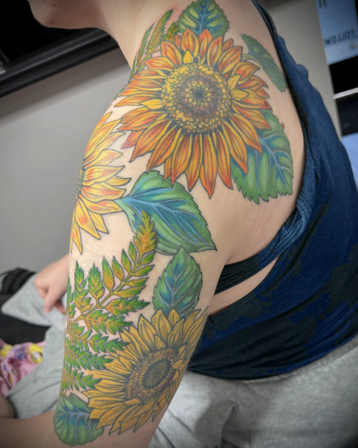 Color sunflower tattoo by Nicole Miller in Missoula Montana