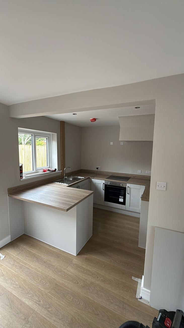 Project Honey completed white shaker-style kitchen with oak-effect worktops