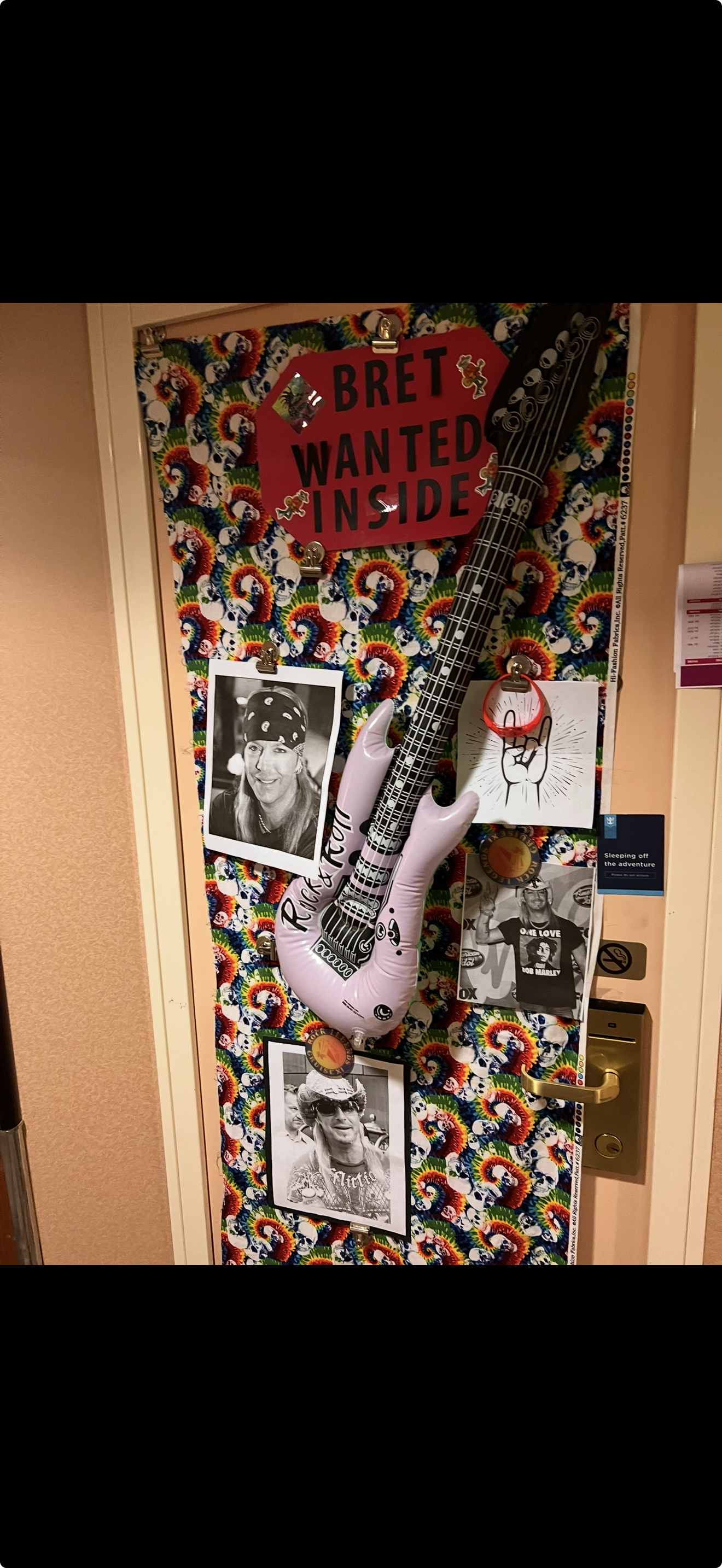 Cruise cabin door covered in tie-dye skull magnetic wrap with inflatable guitar and rock star photos on Rock Legends cruise Cruise cabin door covered in tie-dye skull magnetic wrap with inflatable guitar and rock star photos on Rock Legends cruise