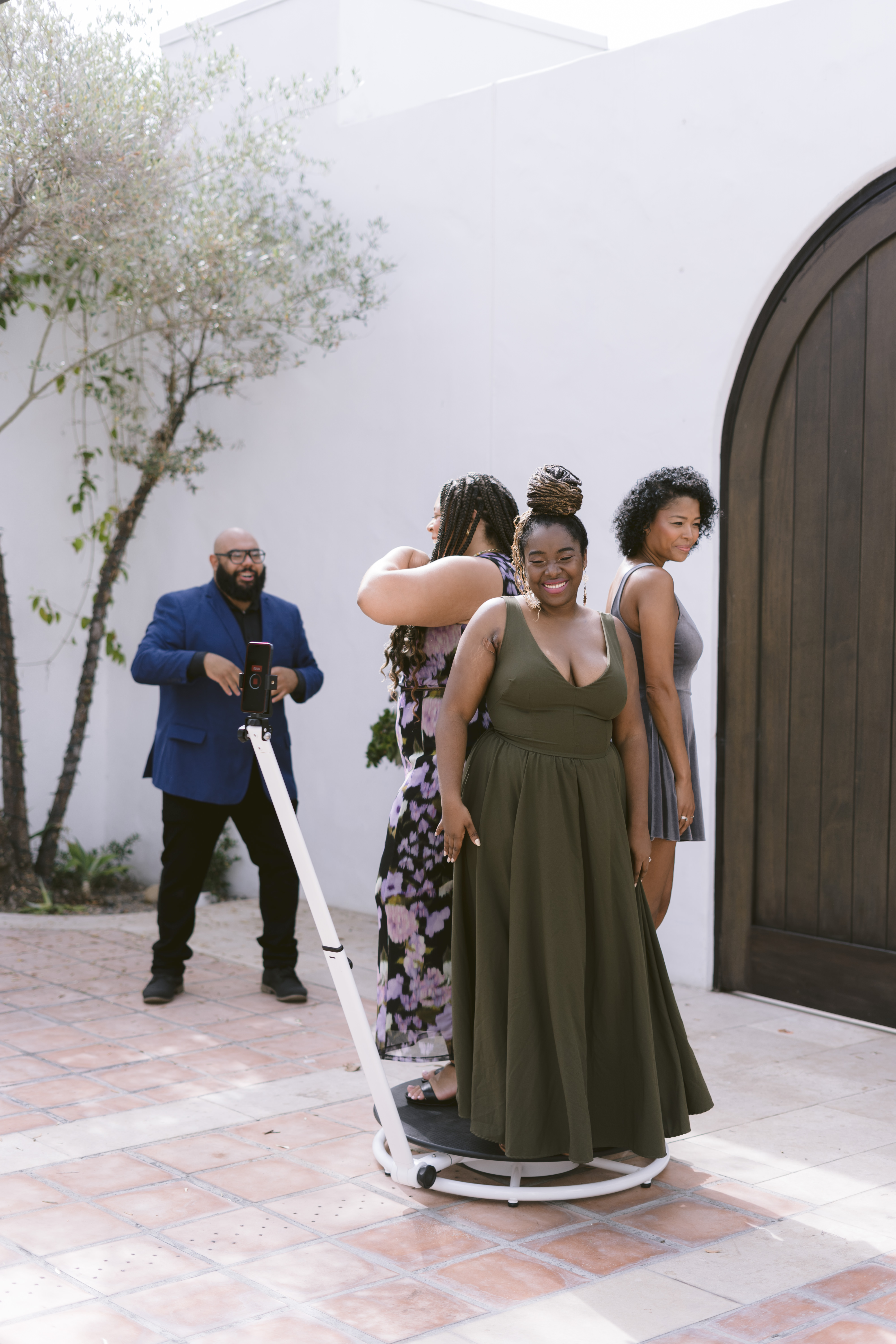 people dancing on a 360 video photo booth at a wedding people dancing on a 360 video photo booth at a wedding
