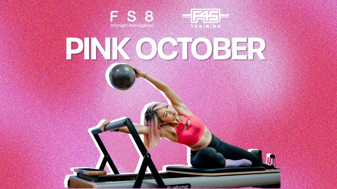 Pink October: a member training on the Reformer against a pink background