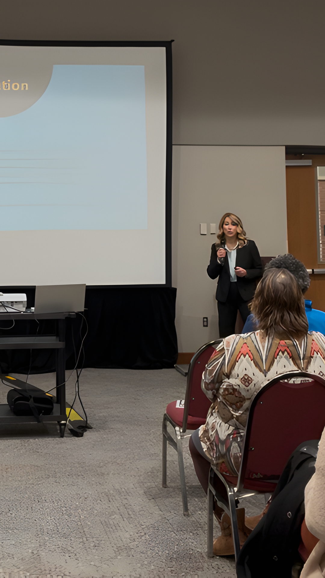 Coach Nikki Rigby presenting to an audience