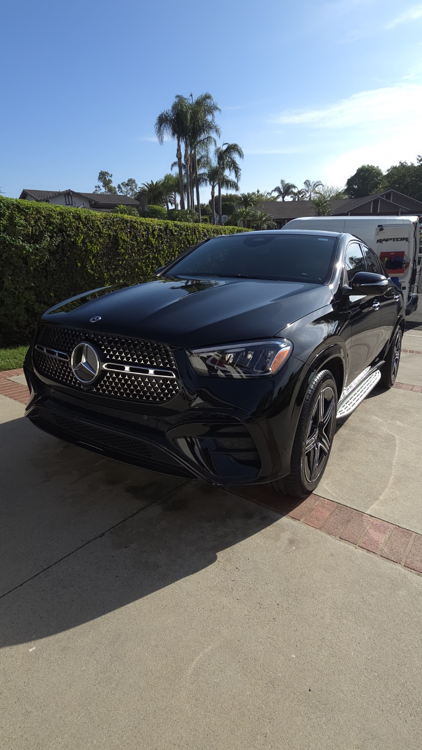 Front three-quarter view showing the maintained glossy finish of a black 2024 Mercedes-Benz GLE Coupe