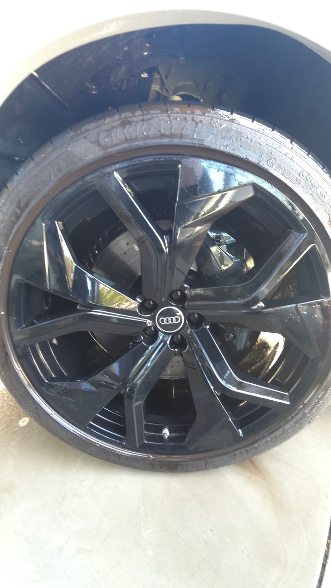 Audi RS Q8 wheel being cleaned during an exterior wash