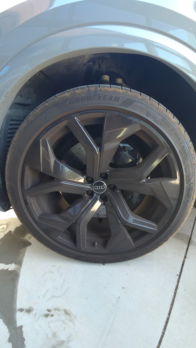 Audi RS Q8 wheel before cleaning during an exterior wash