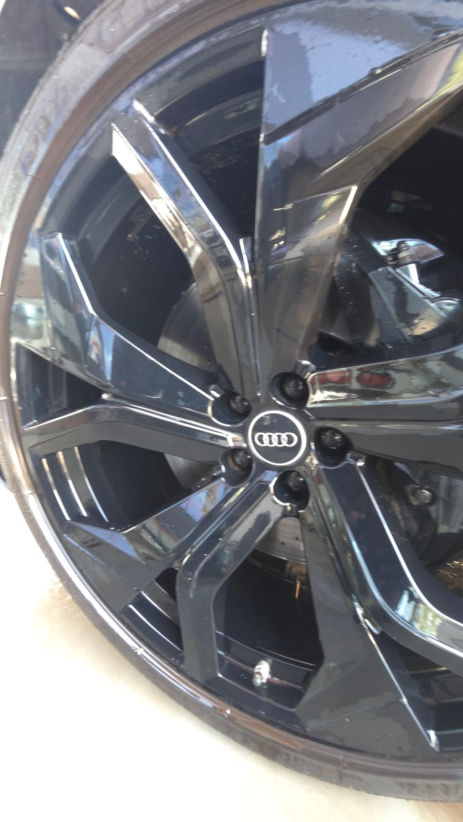 Clean Audi RS Q8 wheel and tire after an exterior wash and wheel care