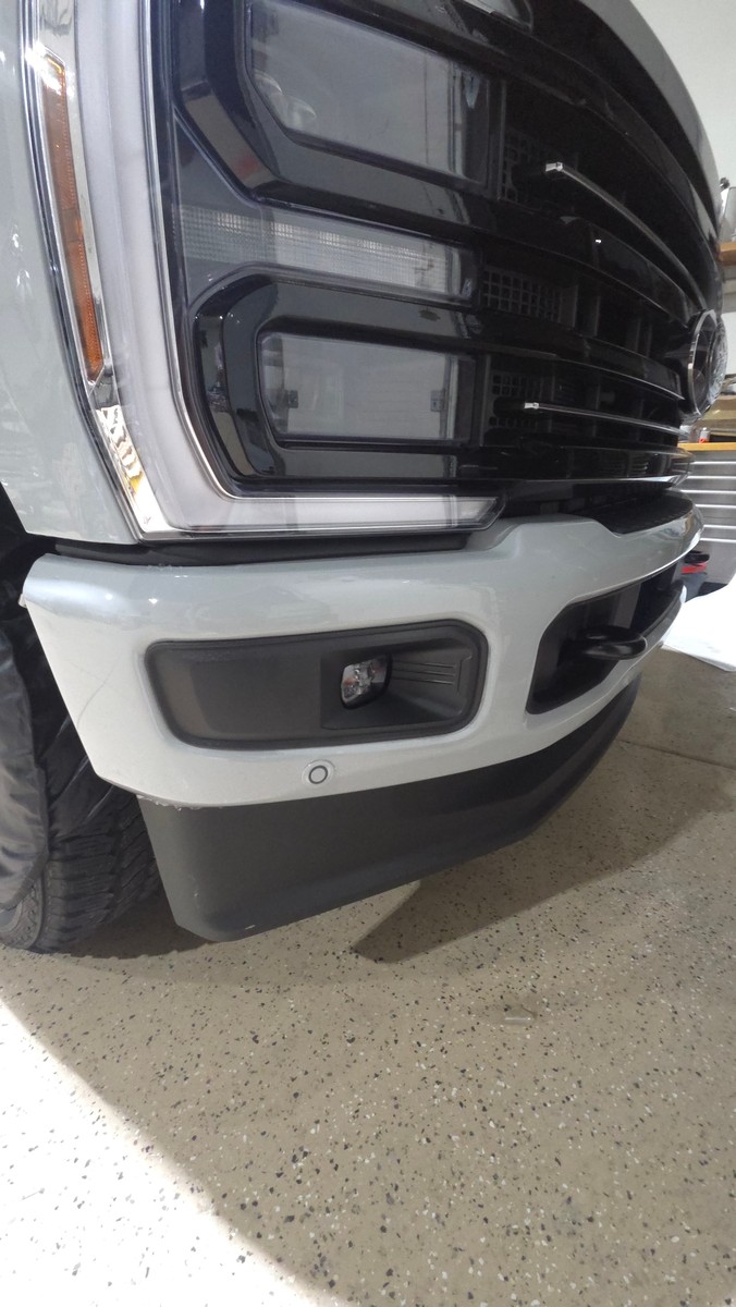 Ford F-350 front bumper during paint protection film installation