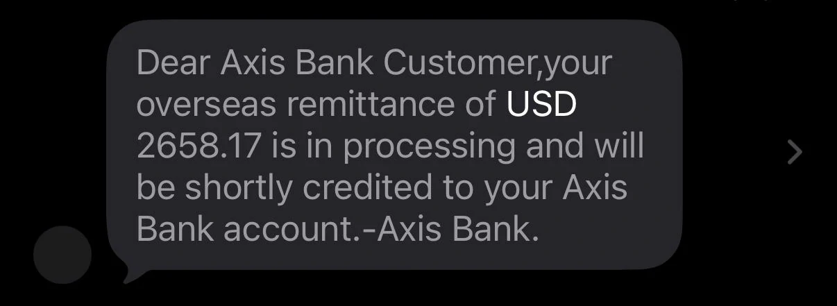 Axis Bank SMS showing USD 2658.17 remittance