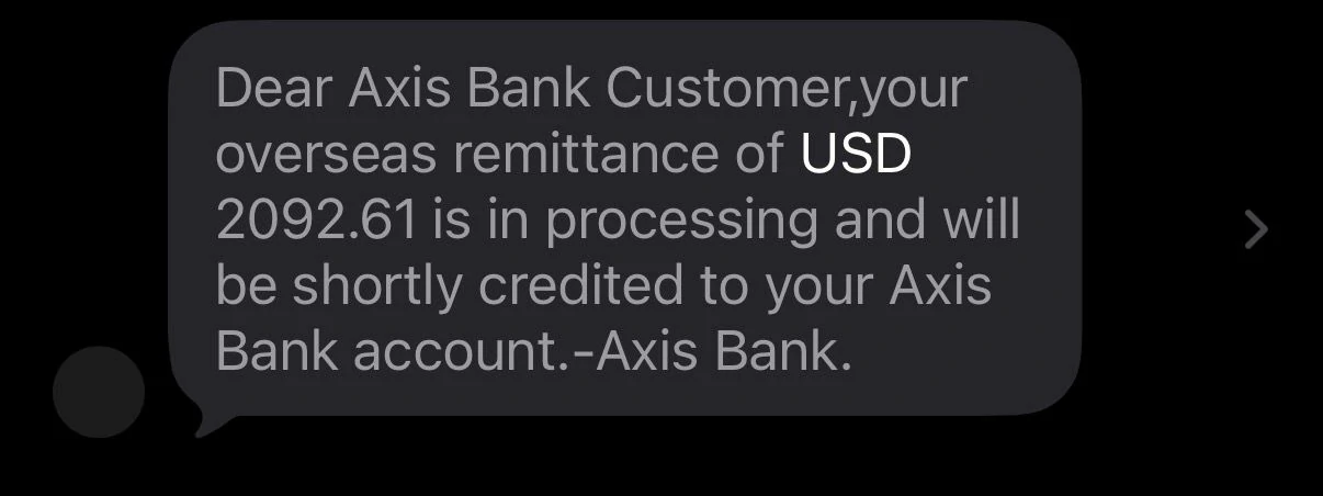 Axis Bank SMS showing USD 2092.61 remittance