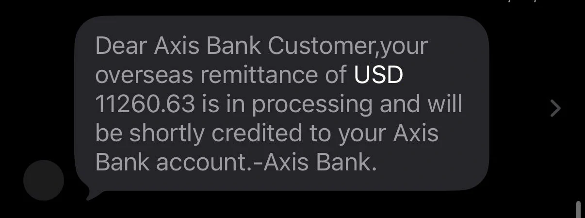 Axis Bank SMS showing USD 11260.63 remittance