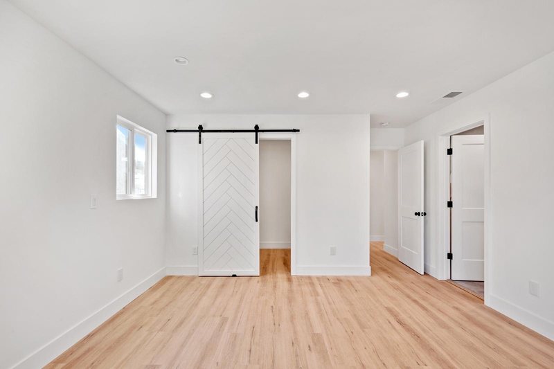 ADU bedroom with barn door Austin