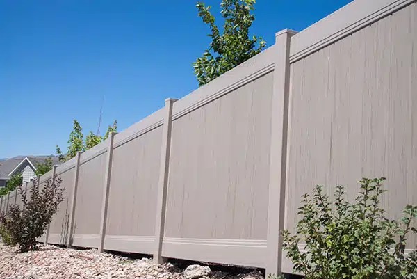 Tan vinyl privacy fence