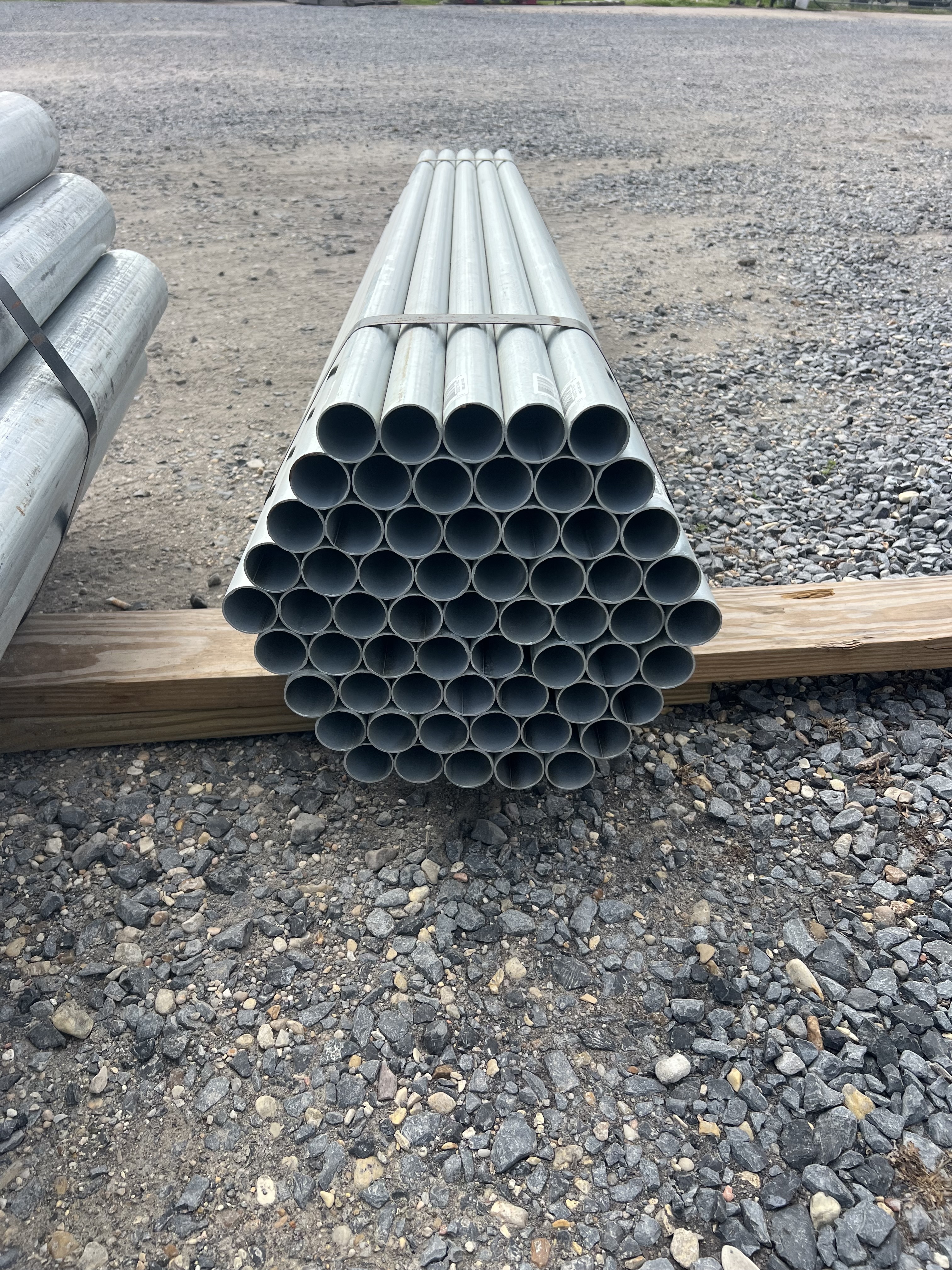 Galvanized fence pipe stacked