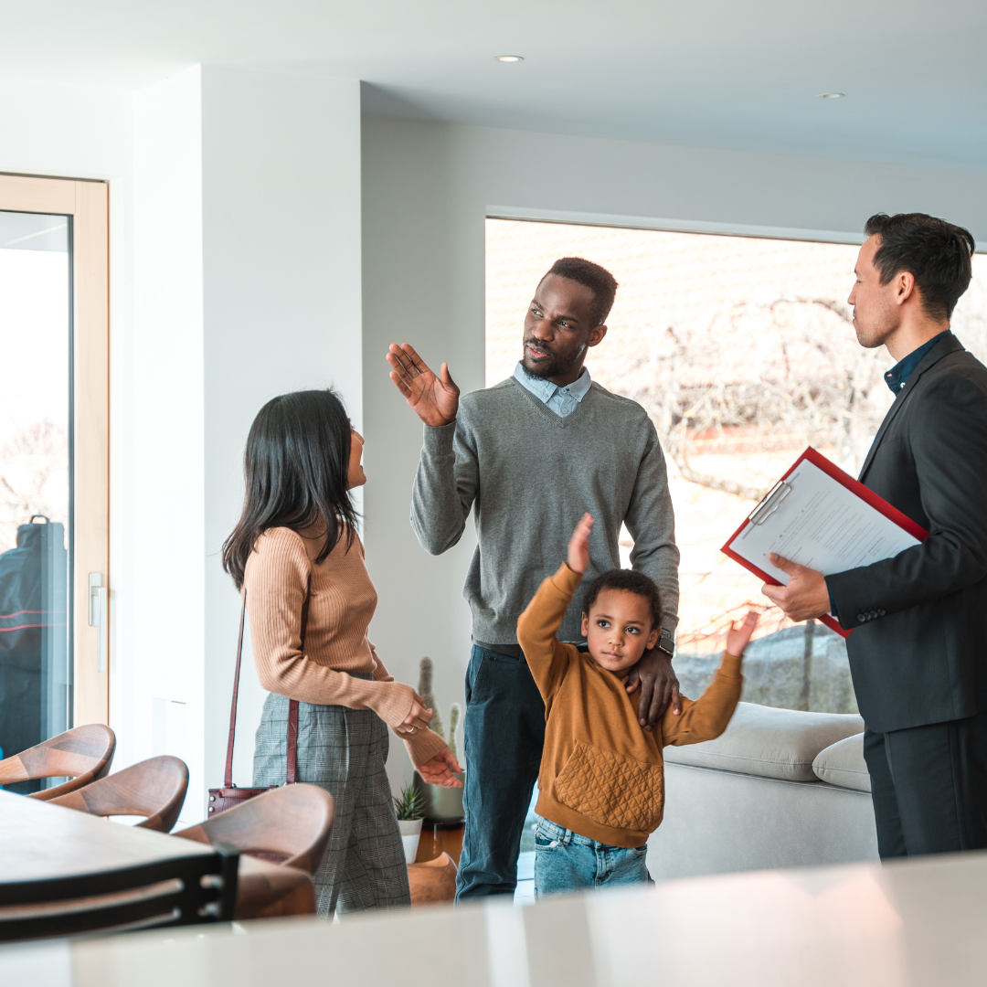 Couple thoughtfully viewing empty home to make informed real estate buying decision