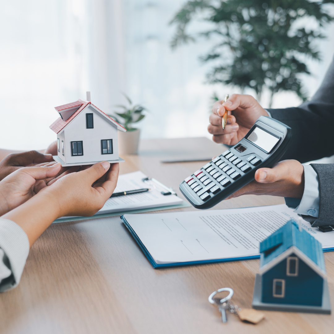Real estate appraiser evaluating the exterior of a modern North Carolina home with a tablet. Real estate appraiser evaluating the exterior of a modern North Carolina home with a tablet.
