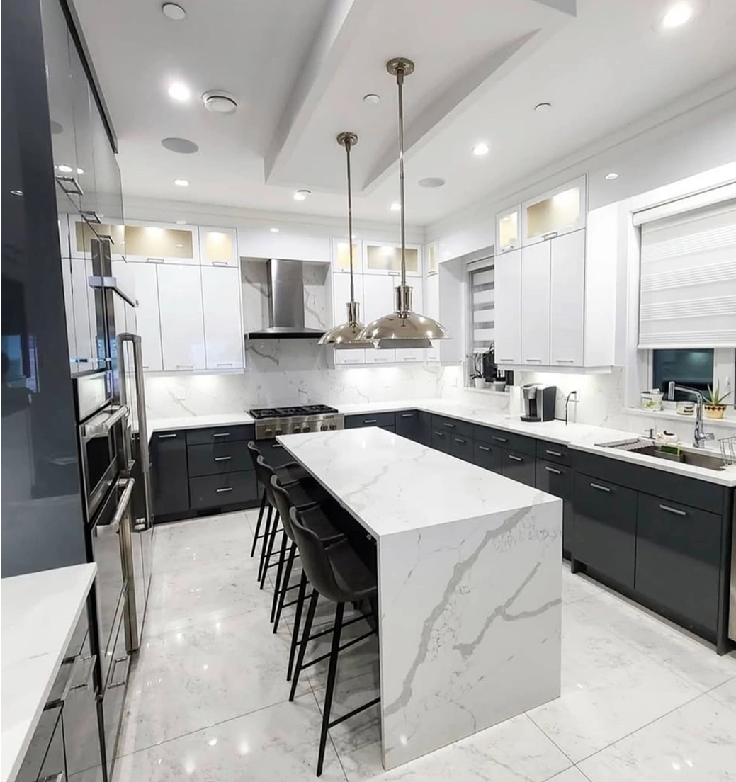 Modern white and dark grey kitchen with marble countertops