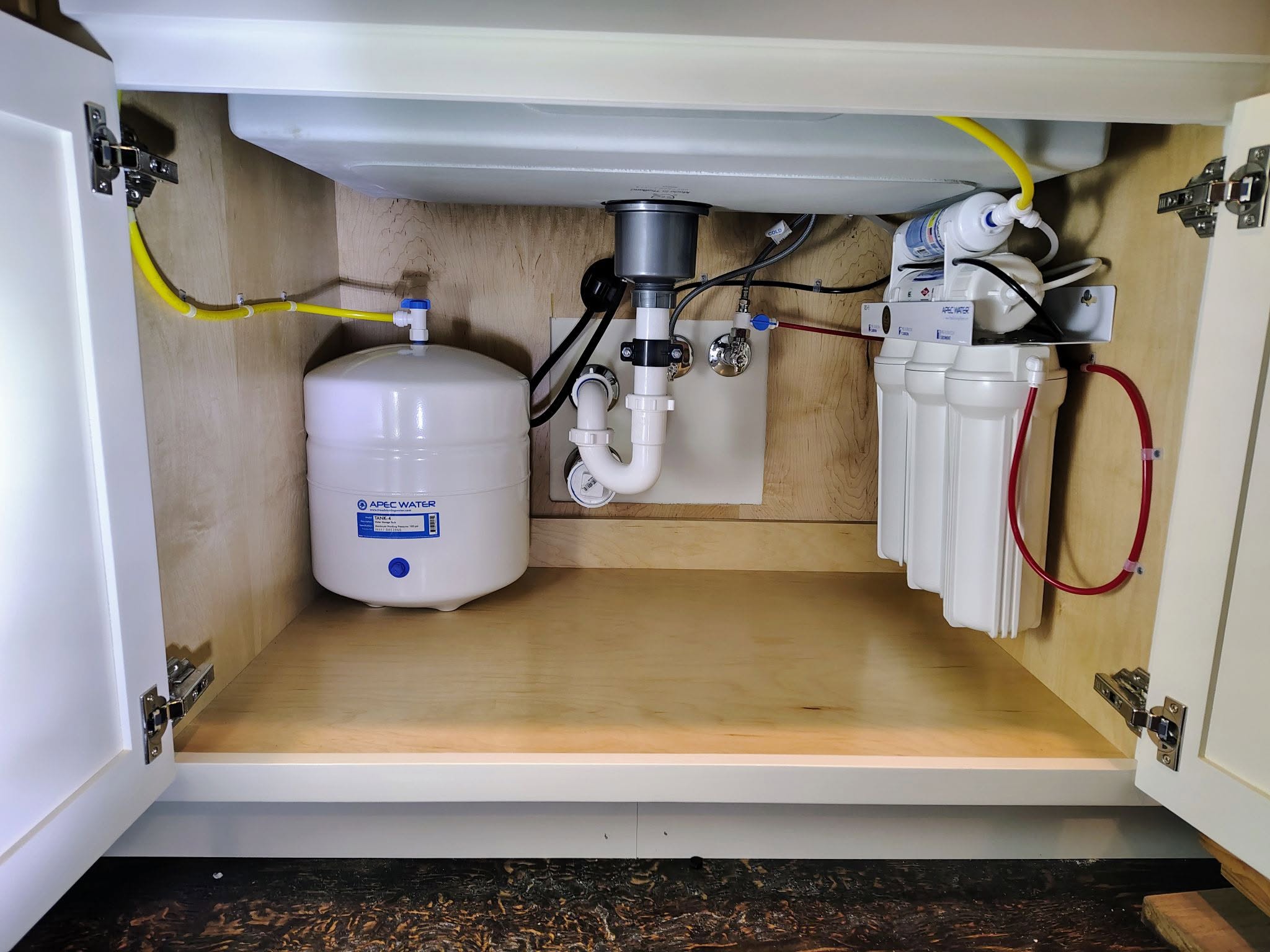 Clean under-sink plumbing installation by Cerda-Pro Plumbing