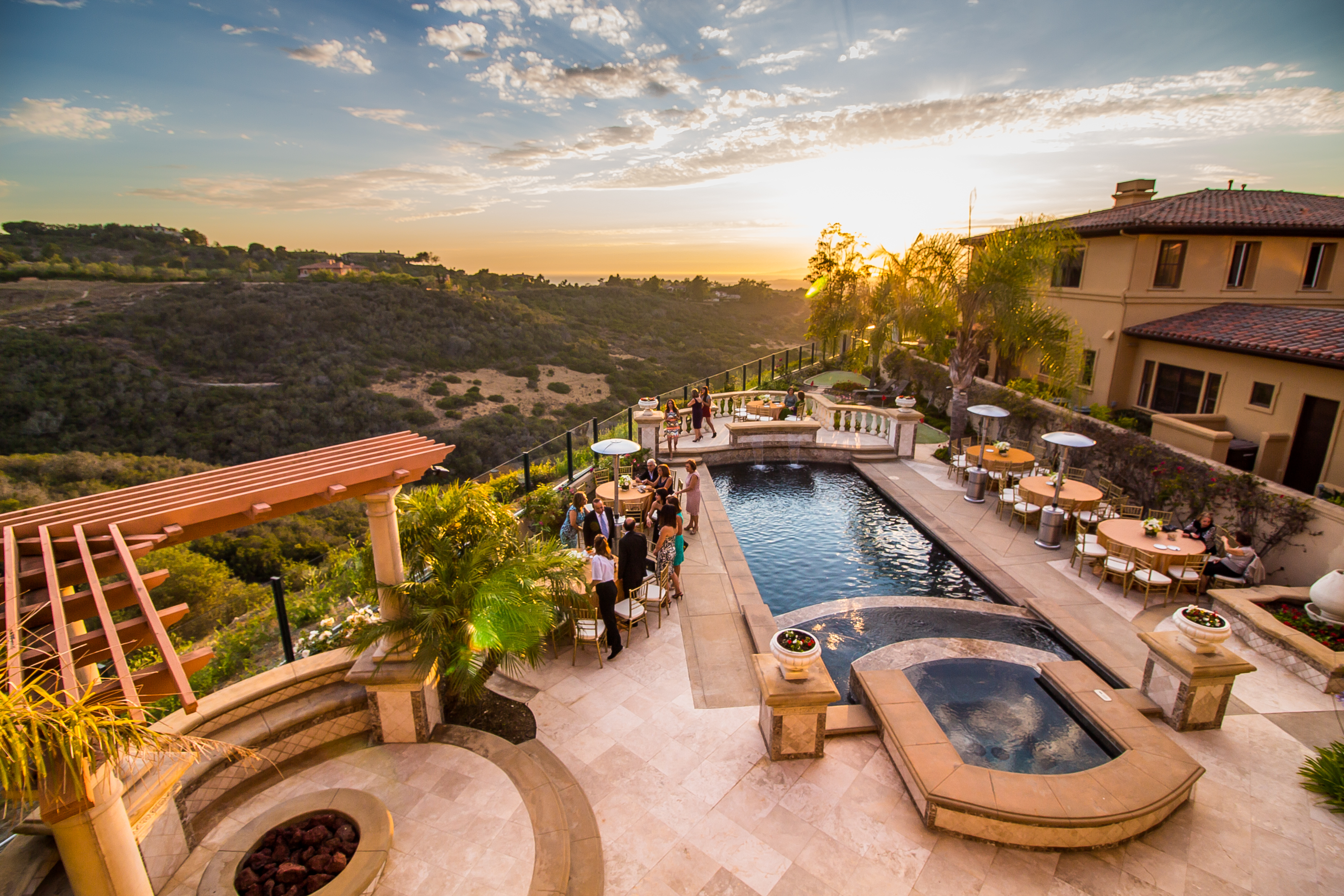A sunlit hillside terrace and pool at sunset, photographed by Ann Goth