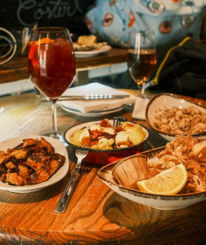 Table spread with sangria, tortilla española, bread, and tapas Table spread with sangria, tortilla española, bread, and tapas