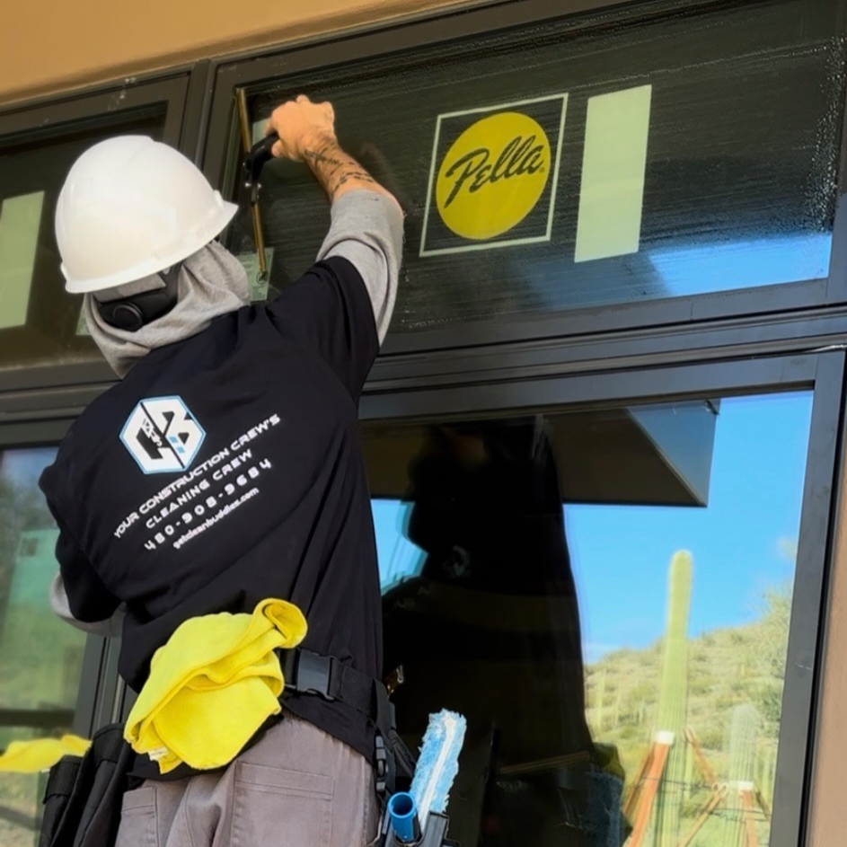 Clean Buddies crew member detailing a window on a Phoenix jobsite