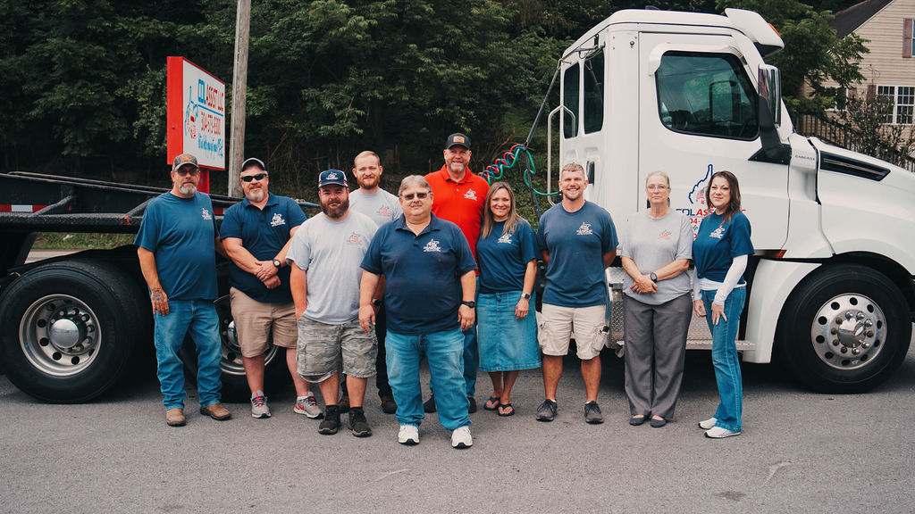 The CDL Assist LLC team standing in front of a tractor trailer