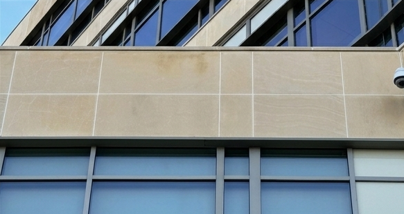 After facade cleaning by WindowClean by Vertex showing cleaned commercial building panels and improved exterior appearance