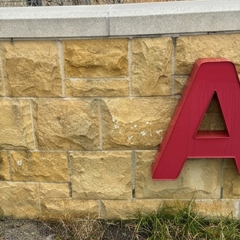 After facade cleaning by WindowClean by Vertex showing restored stone wall with a cleaner exterior finish