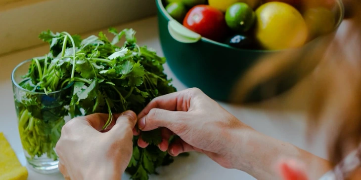 Someone preparing their vegetables on their kitchen countertop Someone preparing their vegetables on their kitchen countertop