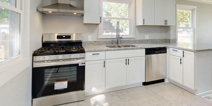 A stove being placed near the kitchen sink