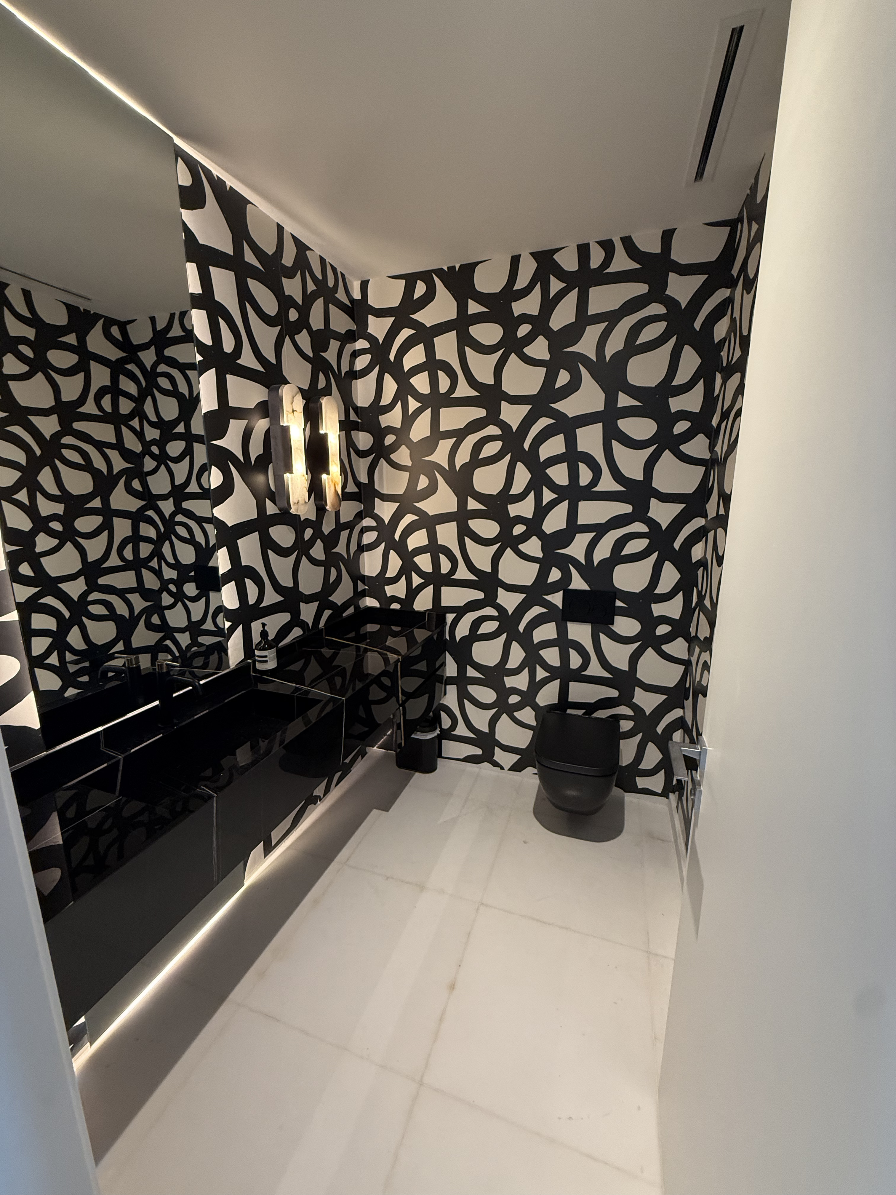 Luxury shower upgrade at Aston Martin Residences Miami Beach — frameless glass and rain shower system