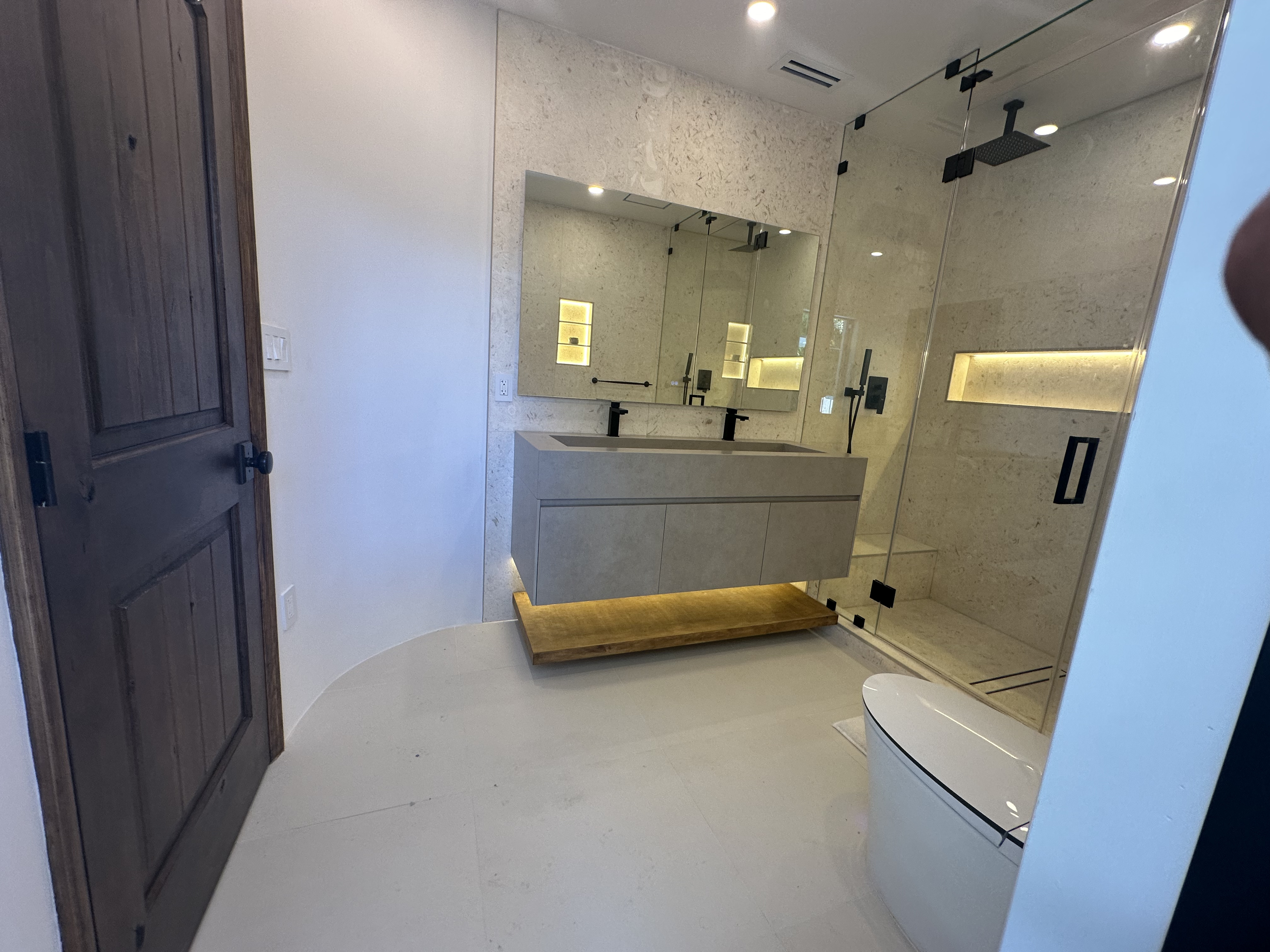 Luxury master bathroom remodel in Coral Gables Miami — marble countertop and custom vanity installation