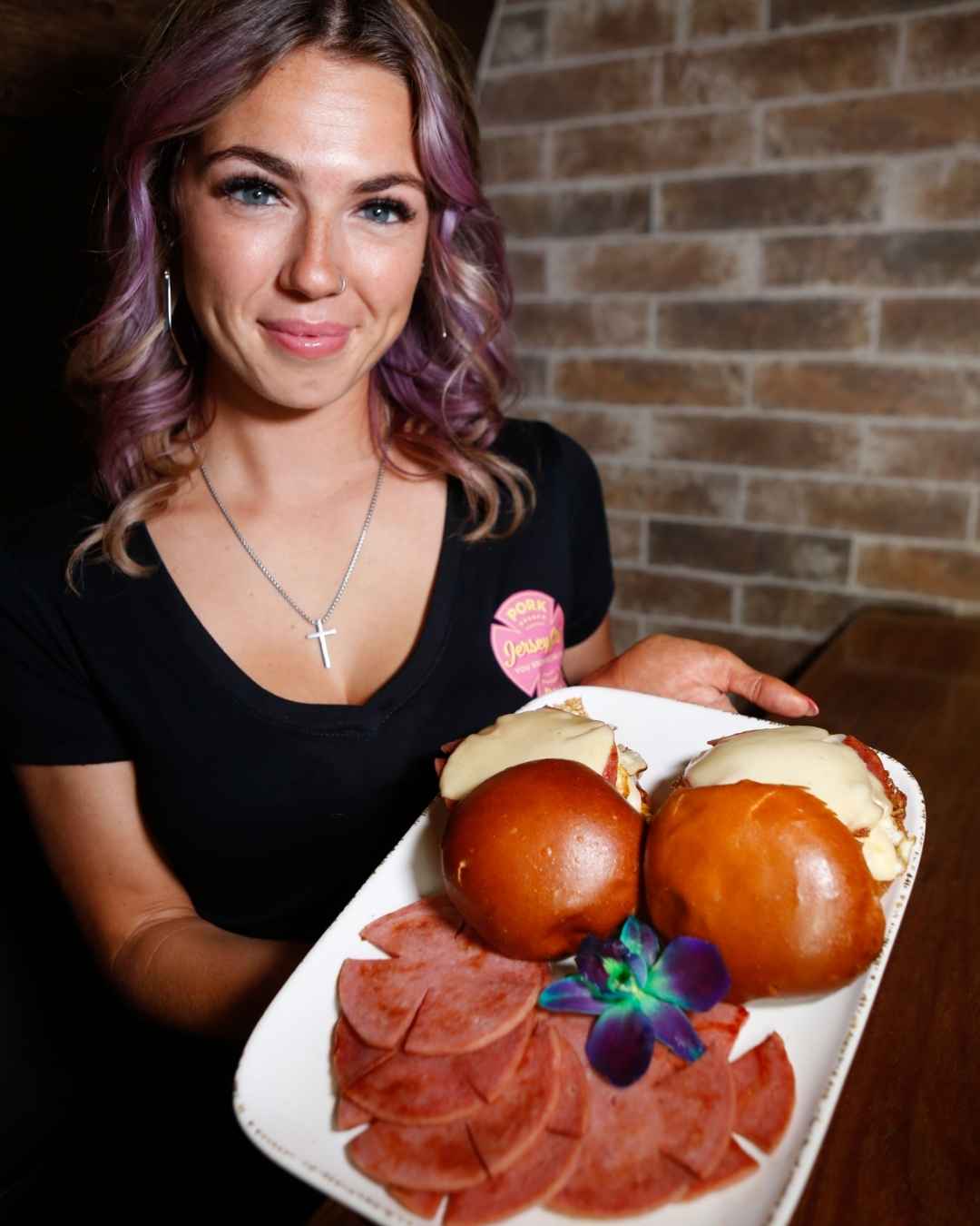 Woman enjoying a Jersey Girl pork roll sandwich