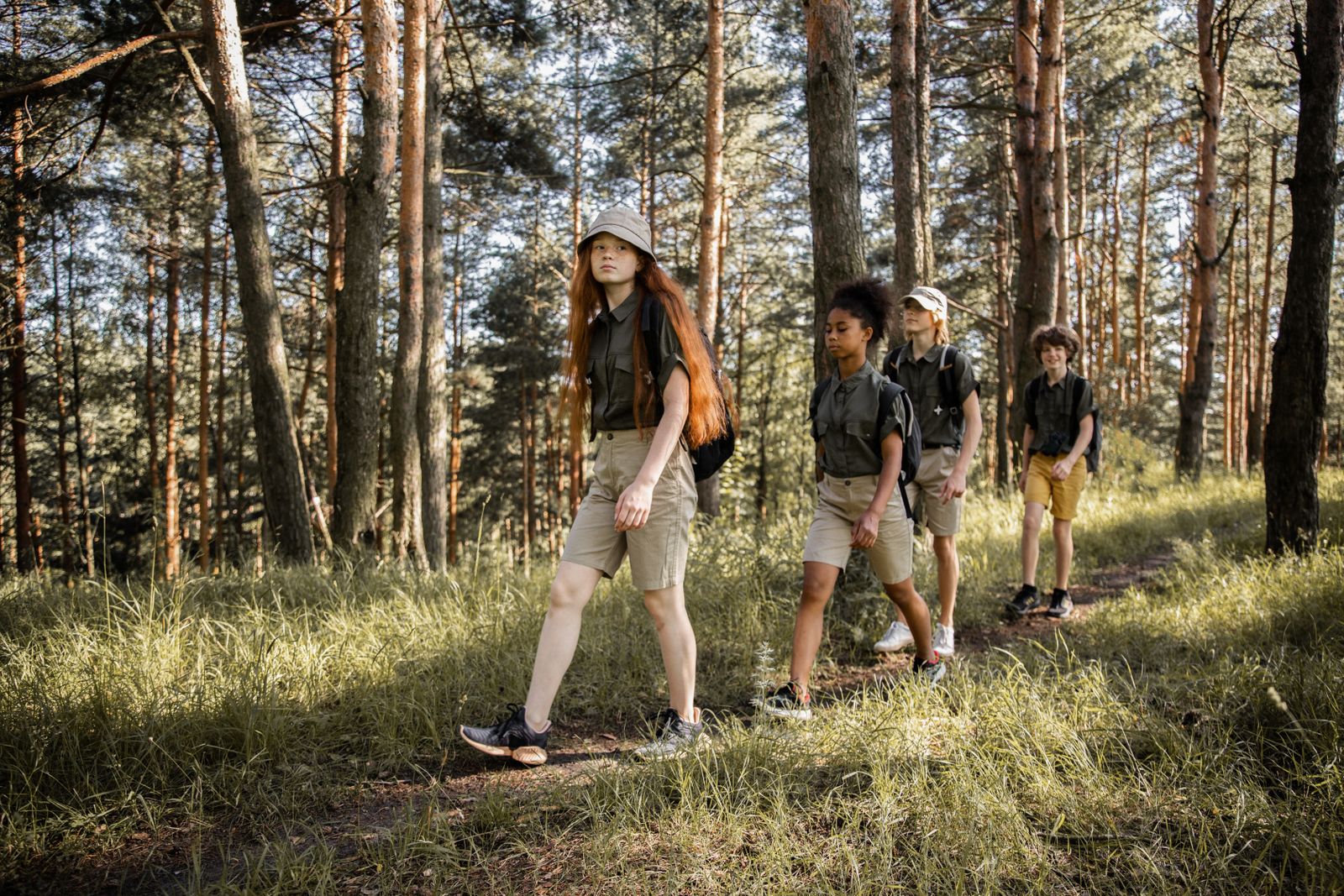 Young learners hiking together on a forest trail