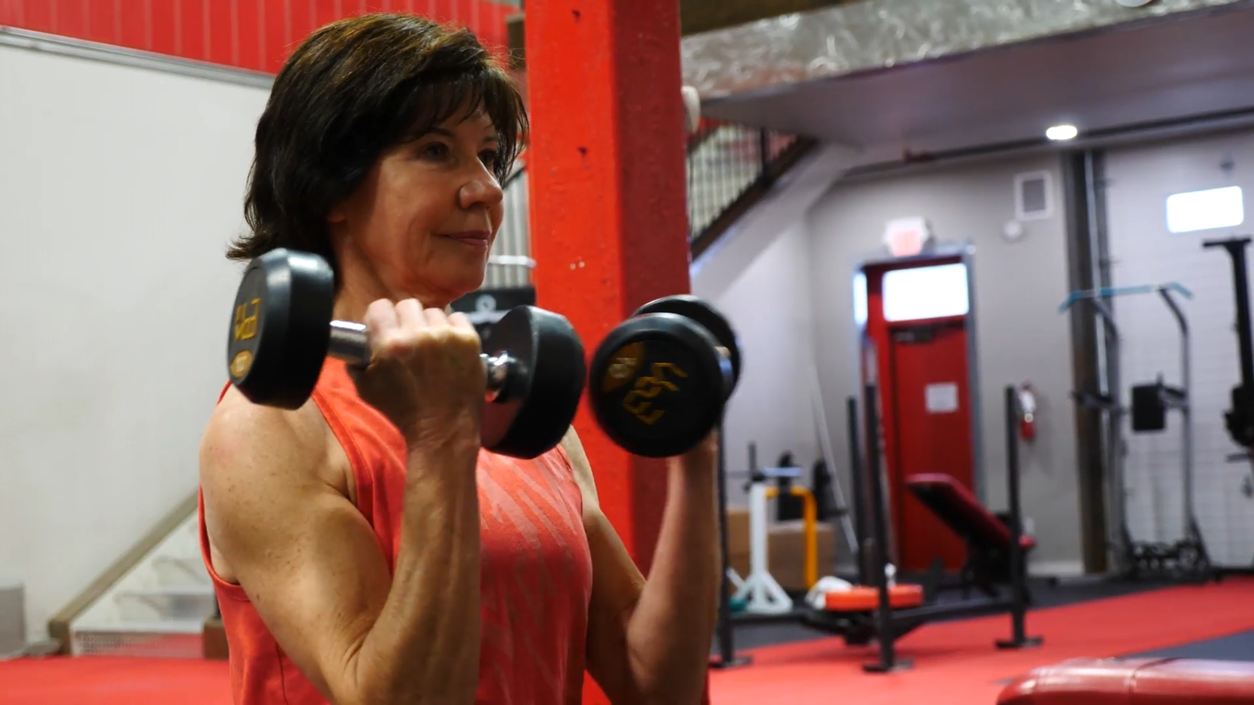 Woman building strength with a barbell at 360 Fitness Sherwood Park