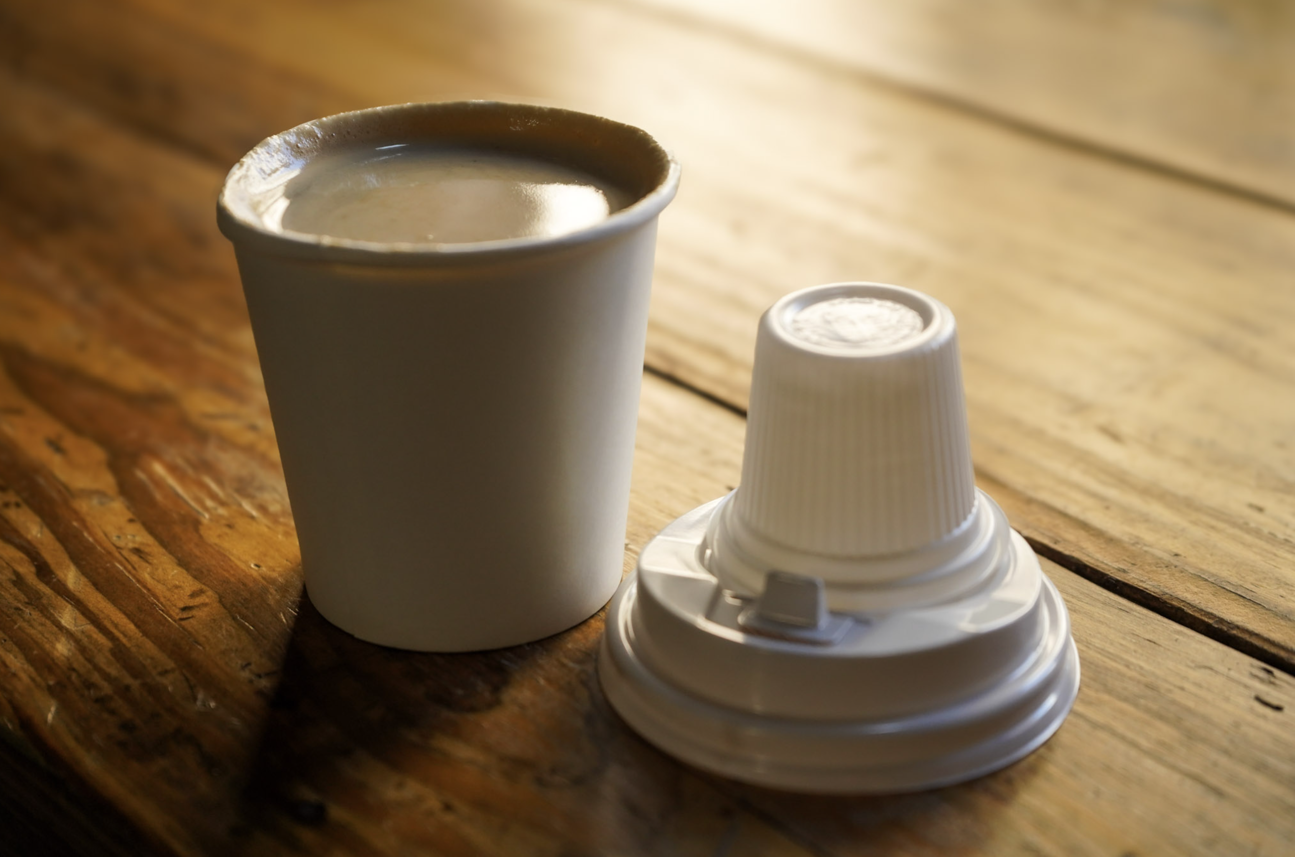 Cortadito in a paper cup with espumita