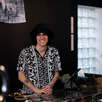 Smiling team member behind the thrift counter