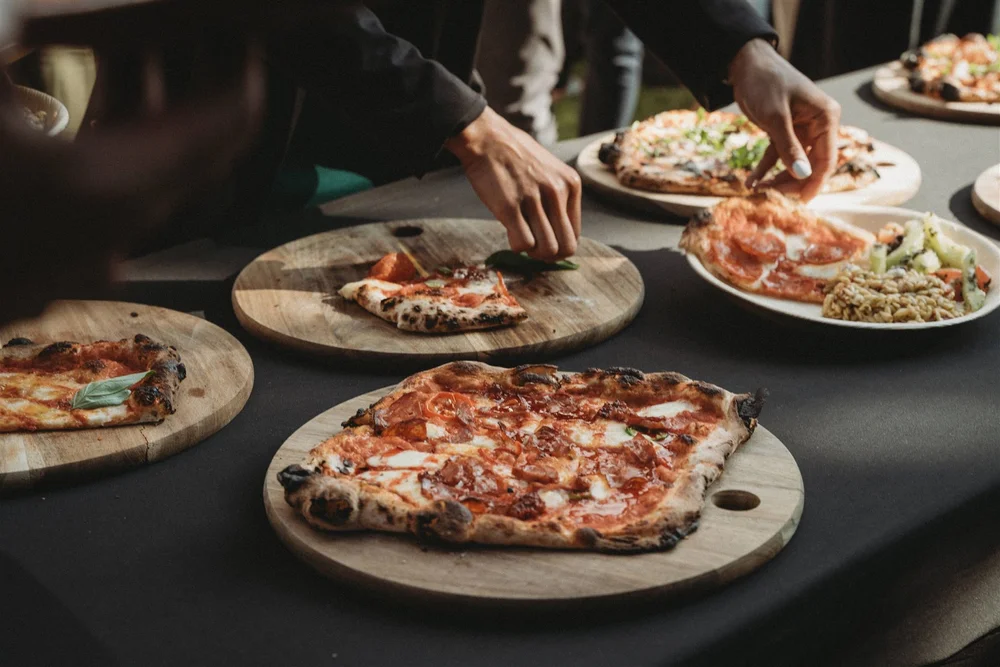 Garlic and Thyme Pepperoni with Hot Honey pizza being served