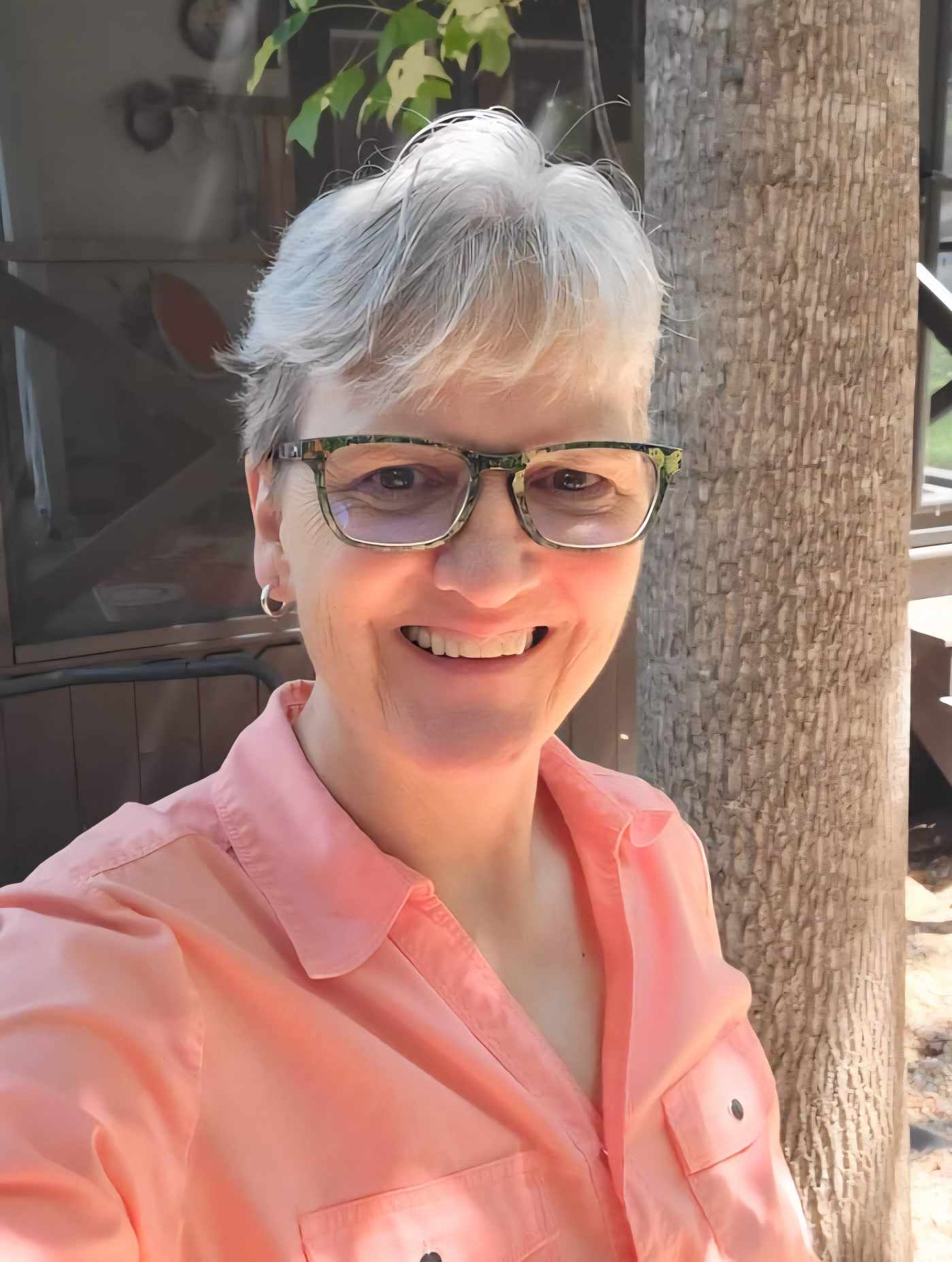 Caudette Eames welles coach smiling outdoors by tree
