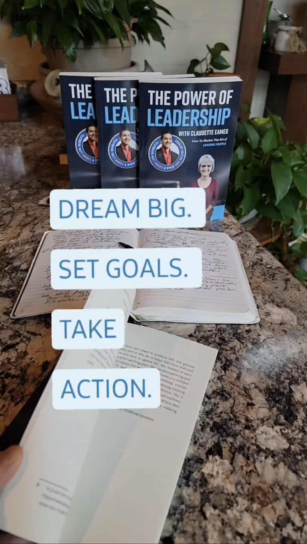 Claudette Eames co-author of The Power of Leadership, open book with journal and motivational quote