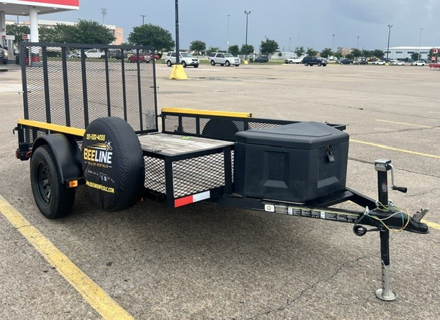 Walk-up utility trailer with wood deck at Beeline Trailer Rentals in Katy, TX