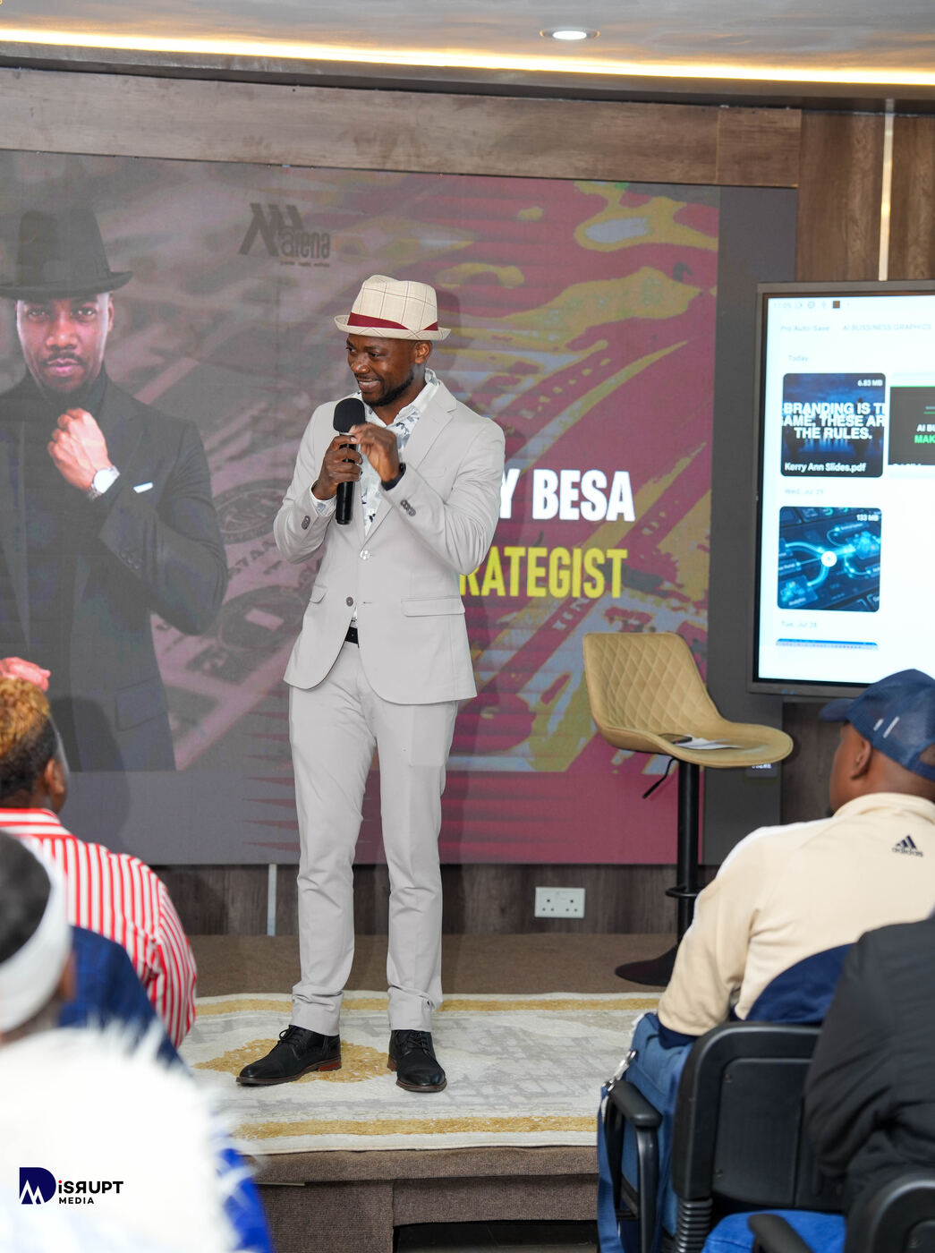 Cee Jay Besa, AI Strategist, on stage at the AI Business Makeover event