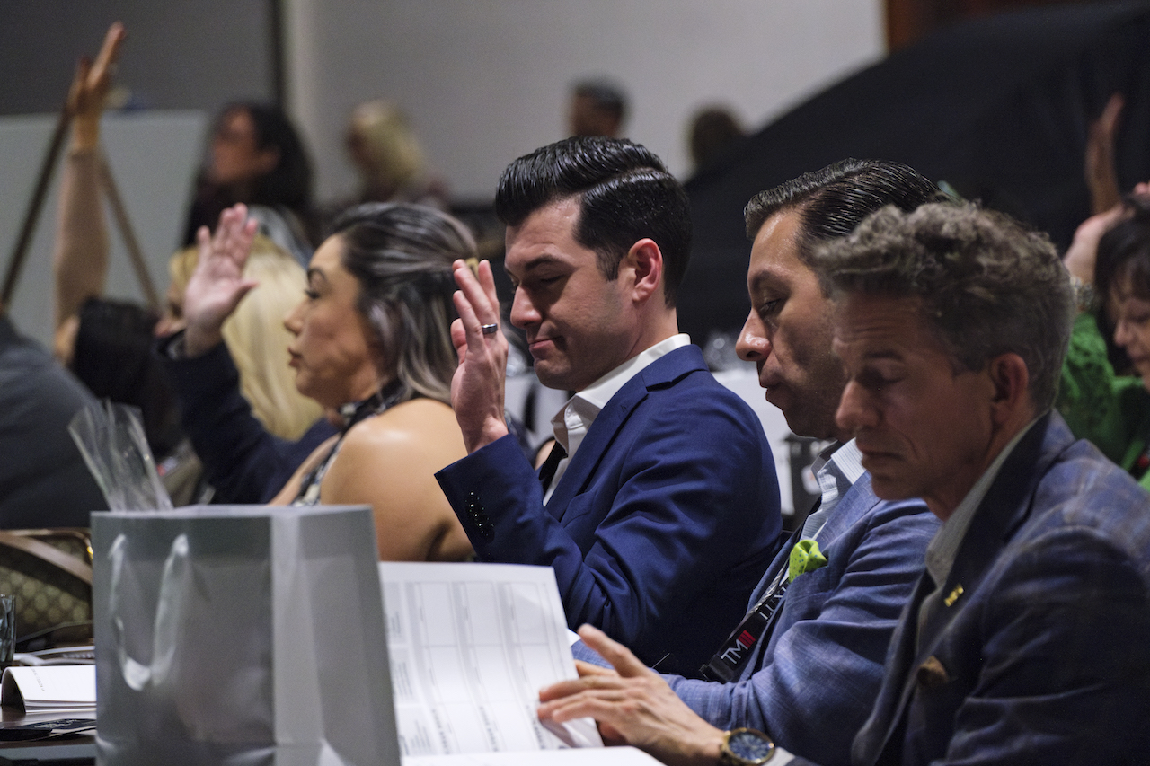 Attendees raising hands