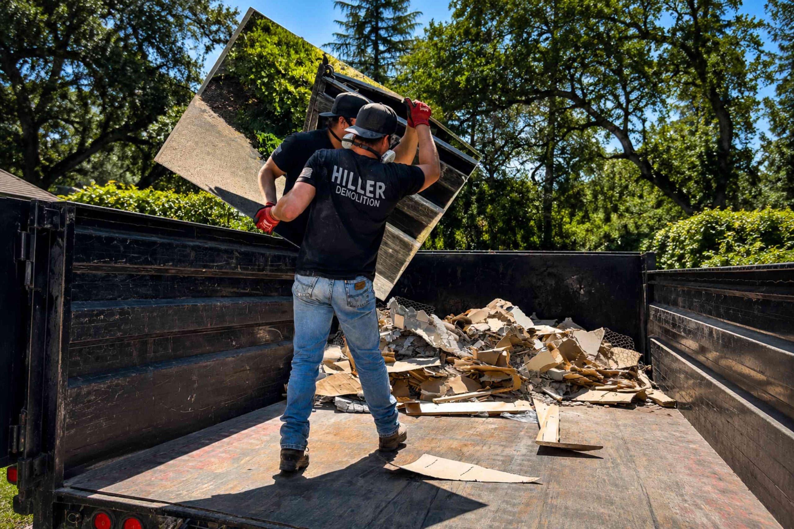 Hiller Demolition crew member working on debris removal