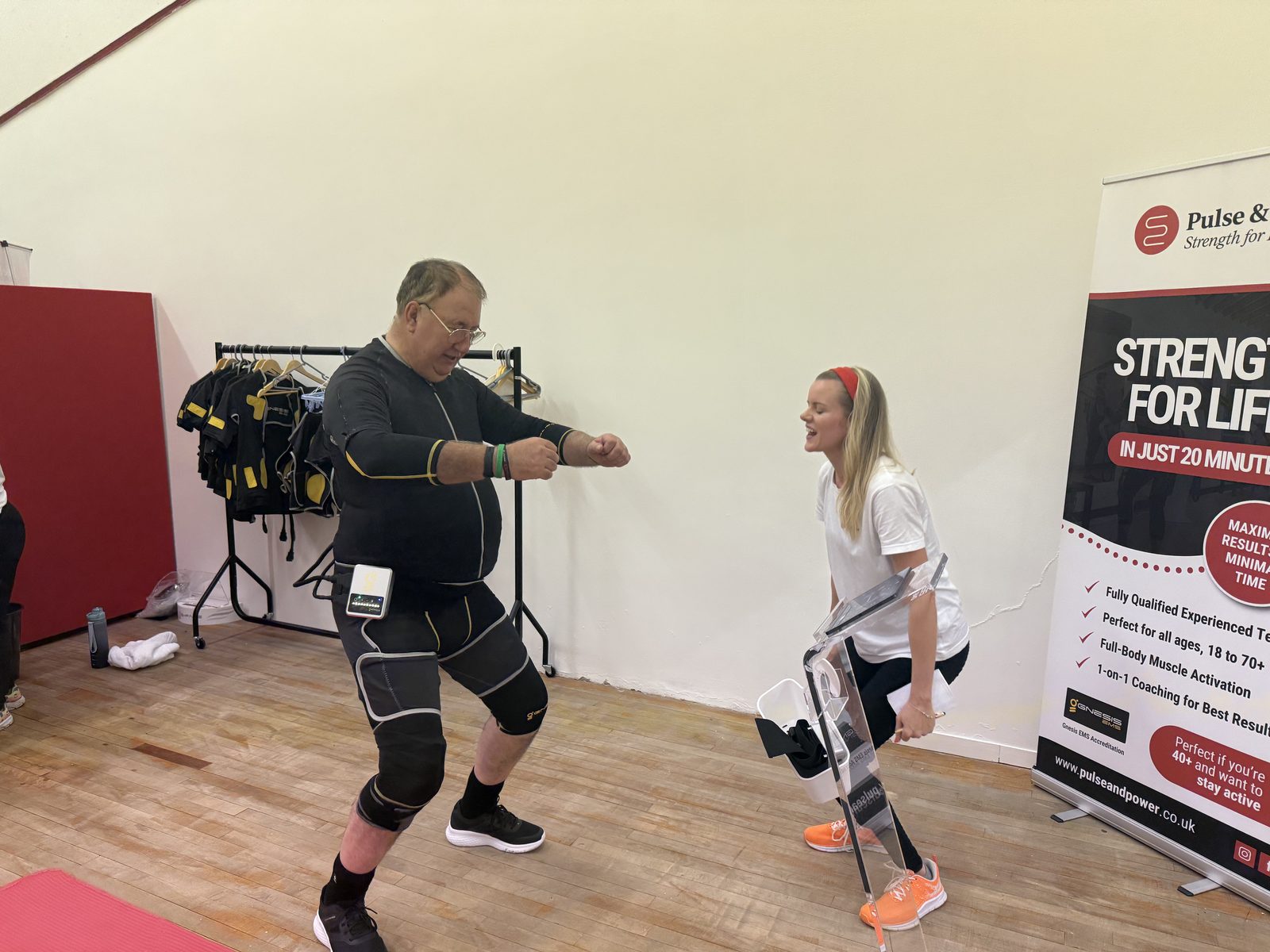 An instructor coaching a member in the studio