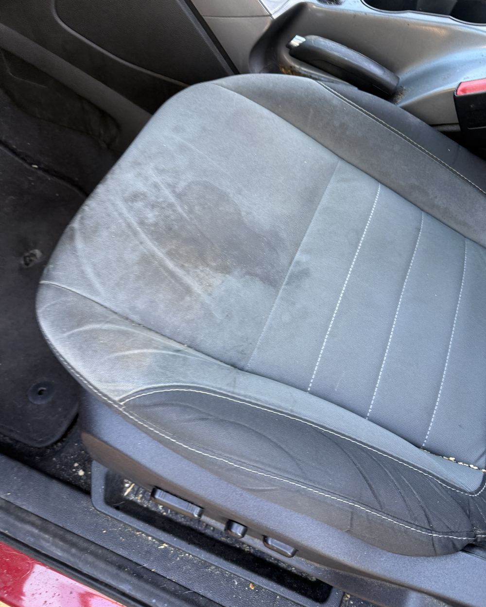 Before: soiled front seat