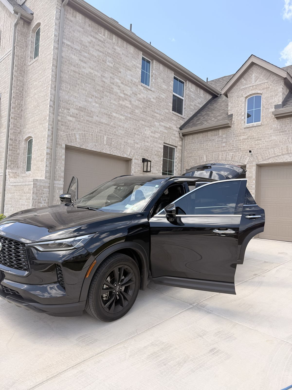 Finished black SUV in the driveway