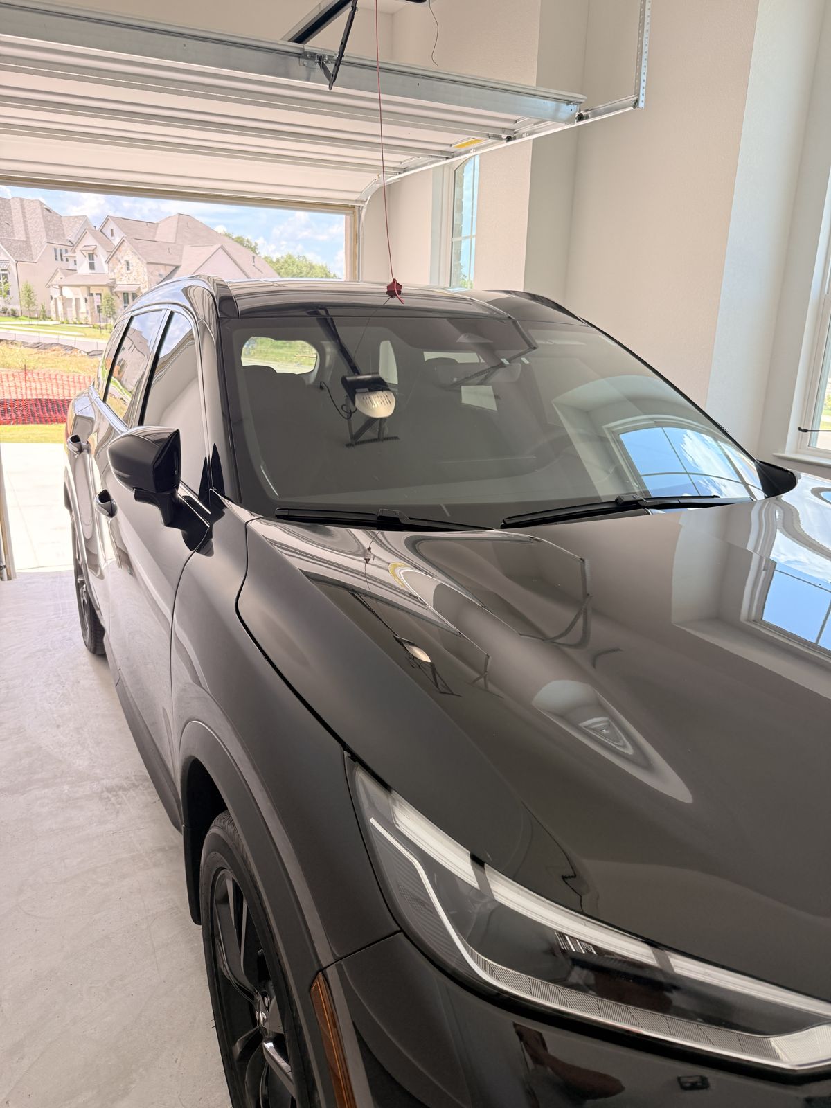 Freshly detailed dark SUV with glossy sealed paint