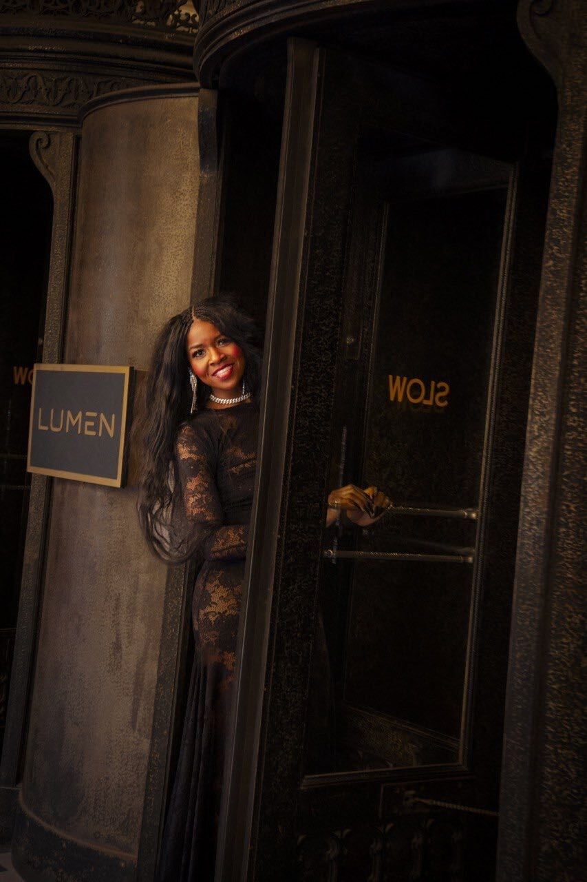Vicki in black lace at a revolving door