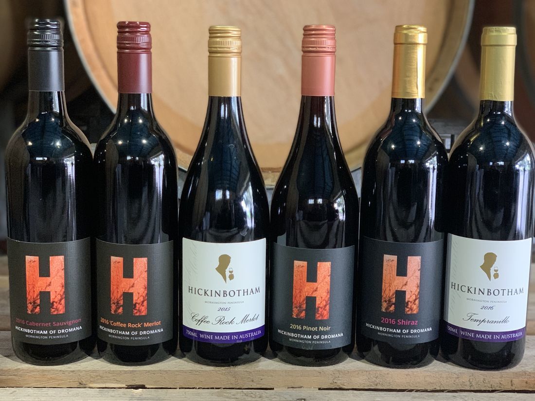 A row of Hickinbotham red wine bottles lined up together